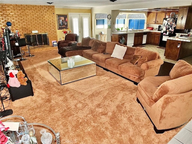 3915 Valencia Ave, San Bernardino, CA 92404 - living area featuring crown molding and light carpet