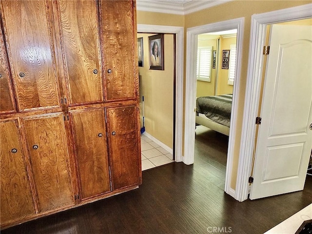 3915 Valencia Ave, San Bernardino, CA 92404 - hall featuring baseboards, ornamental molding, and dark wood-type flooring