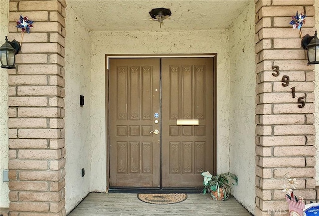 3915 Valencia Ave, San Bernardino, CA 92404 - entrance to property featuring stucco siding and brick siding