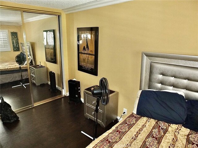 3915 Valencia Ave, San Bernardino, CA 92404 - bedroom featuring crown molding, baseboards, multiple windows, and a closet