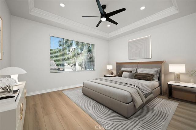 17 Calvados, Newport Coast, CA 92657 - bedroom with a raised ceiling, baseboards, ornamental molding, recessed lighting, and light wood-style flooring