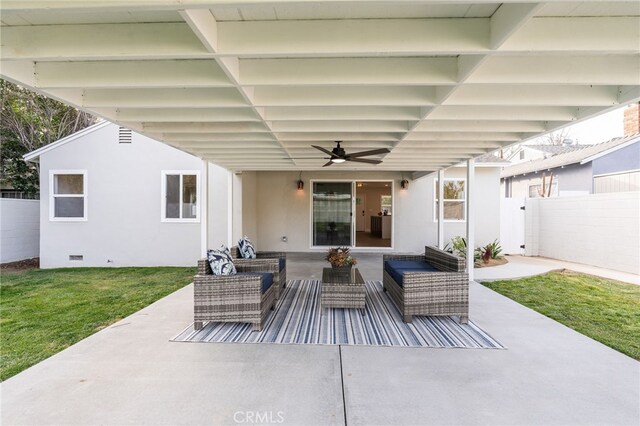 view of patio with fence, ceiling fan, and an outdoor living space