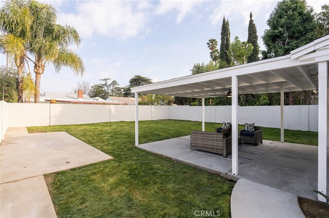 view of yard with a fenced backyard and a patio area