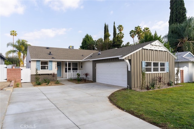 ranch-style home with a garage, board and batten siding, a gate, concrete driveway, and covered porch