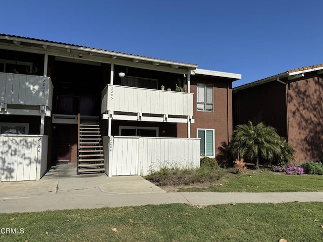 1300 Saratoga Ave Unit 2204, Ventura, CA 93003 - view of front facade with stairs and stucco siding