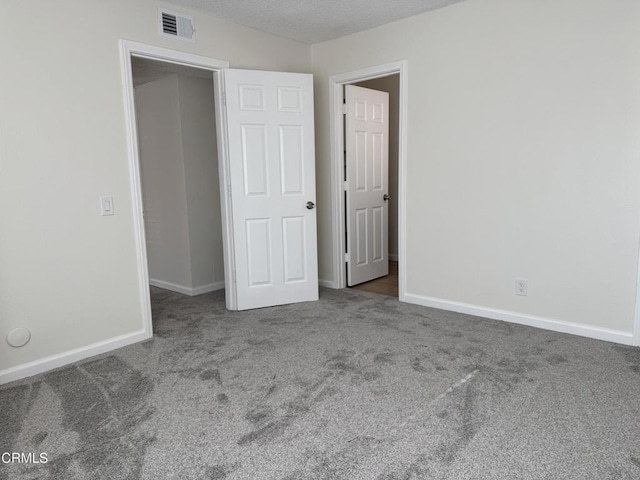 1300 Saratoga Ave Unit 2204, Ventura, CA 93003 - unfurnished bedroom with baseboards, visible vents, and carpet