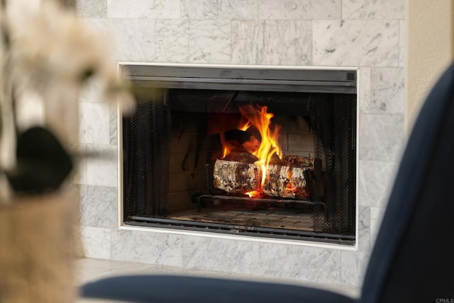 details featuring a tile fireplace