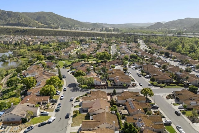 birds eye view of property with a mountain view and a residential view