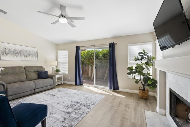 4972 Lake Shore Ct, Fallbrook, CA 92028 - living area featuring a ceiling fan, baseboards, wood finished floors, a fireplace, and vaulted ceiling