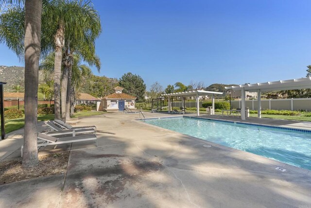 4972 Lake Shore Ct, Fallbrook, CA 92028 - community pool featuring a pergola, fence, and a patio area