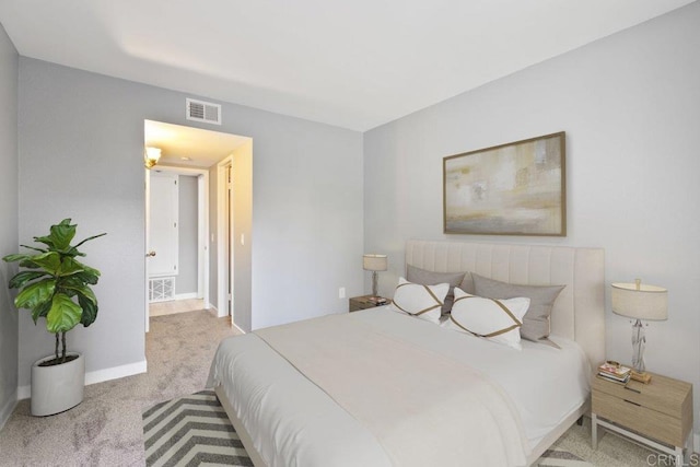 bedroom with baseboards, carpet, and visible vents