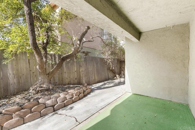 view of patio / terrace featuring fence