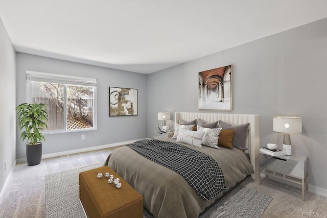bedroom with carpet floors and baseboards