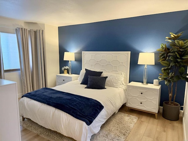 bedroom featuring light wood-type flooring