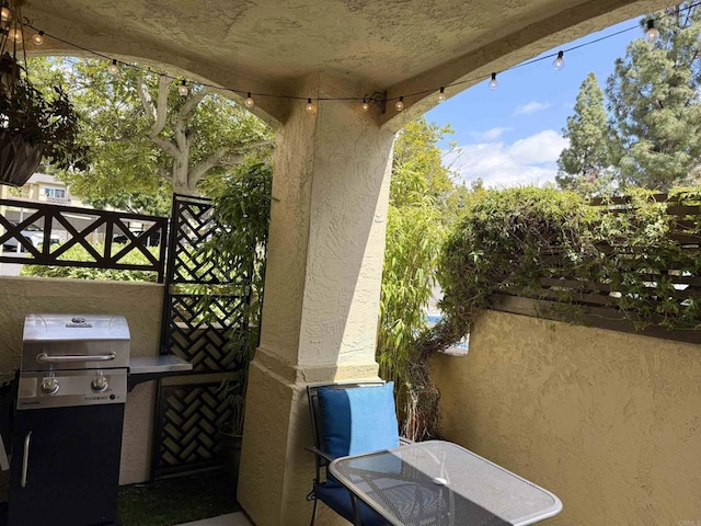 view of patio featuring a grill