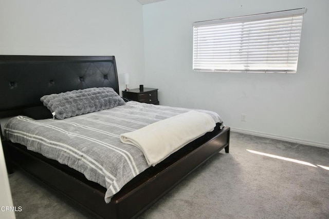 carpeted bedroom with baseboards