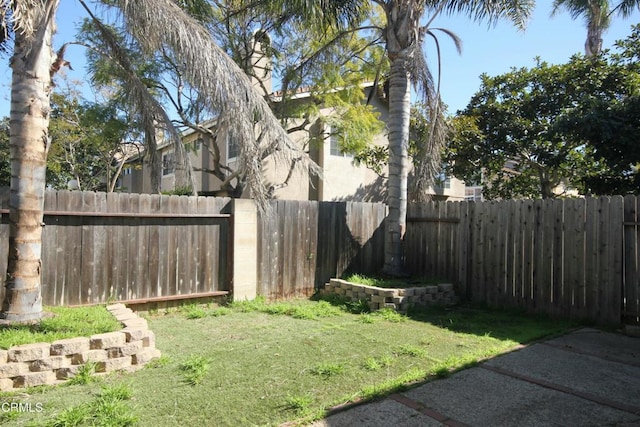 view of yard with a fenced backyard