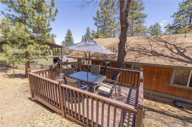 deck with outdoor dining space