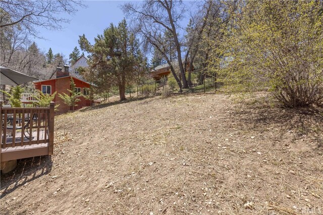 view of yard with a wooden deck