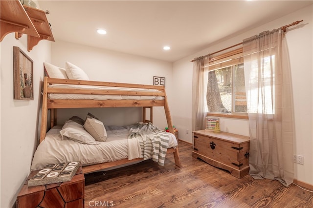 bedroom featuring recessed lighting, baseboards, and wood finished floors