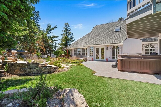 1031 Black Oaks Dr, Lake Arrowhead, CA 92352 - view of green lawn with a hot tub, french doors, and a patio