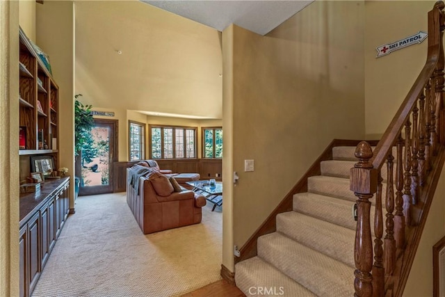 1031 Black Oaks Dr, Lake Arrowhead, CA 92352 - stairs featuring a towering ceiling and carpet