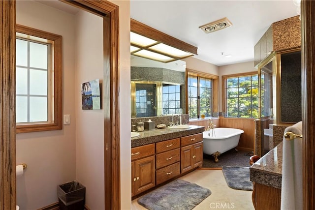 1031 Black Oaks Dr, Lake Arrowhead, CA 92352 - bathroom with double vanity, a freestanding bath, a wainscoted wall, and an enclosed shower