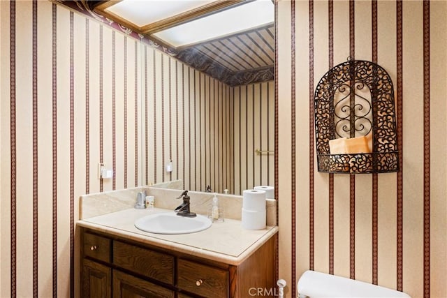 1031 Black Oaks Dr, Lake Arrowhead, CA 92352 - bathroom featuring wallpapered walls and vanity