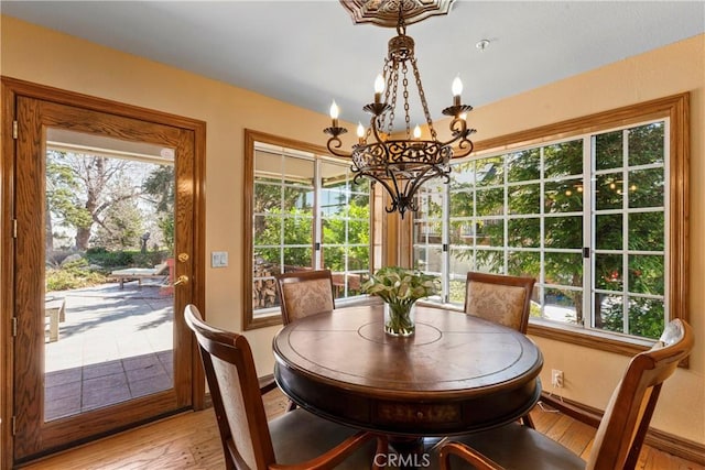 1031 Black Oaks Dr, Lake Arrowhead, CA 92352 - dining space with a chandelier and light wood-style floors