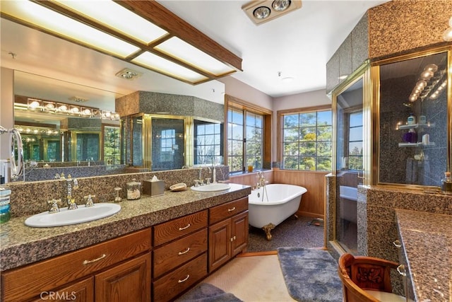 1031 Black Oaks Dr, Lake Arrowhead, CA 92352 - bathroom featuring a stall shower, double vanity, a soaking tub, and a wainscoted wall
