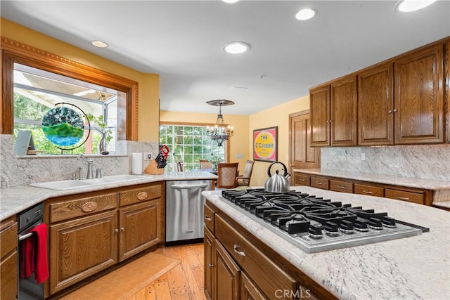 1031 Black Oaks Dr, Lake Arrowhead, CA 92352 - kitchen featuring stainless steel appliances, light countertops, light wood-style flooring, brown cabinets, and recessed lighting