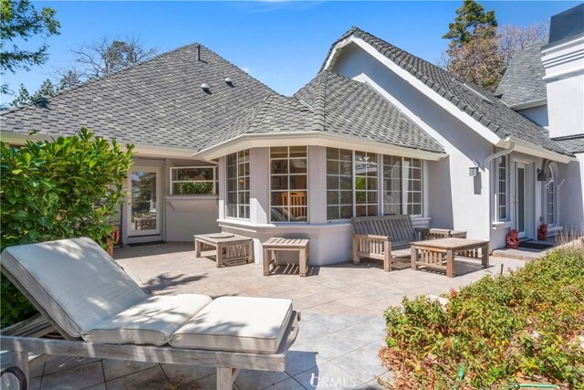 1031 Black Oaks Dr, Lake Arrowhead, CA 92352 - rear view of property featuring a patio area, stucco siding, and an outdoor living space