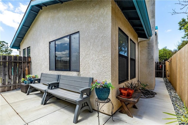 9375 Musselman Dr Unit A, Atascadero, CA 93422 - exterior space featuring a fenced backyard, stucco siding, and a patio area