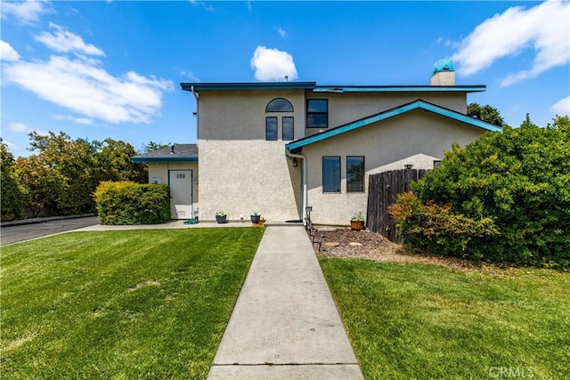 9375 Musselman Dr Unit A, Atascadero, CA 93422 - traditional-style home featuring fence, stucco siding, a chimney, and a front lawn
