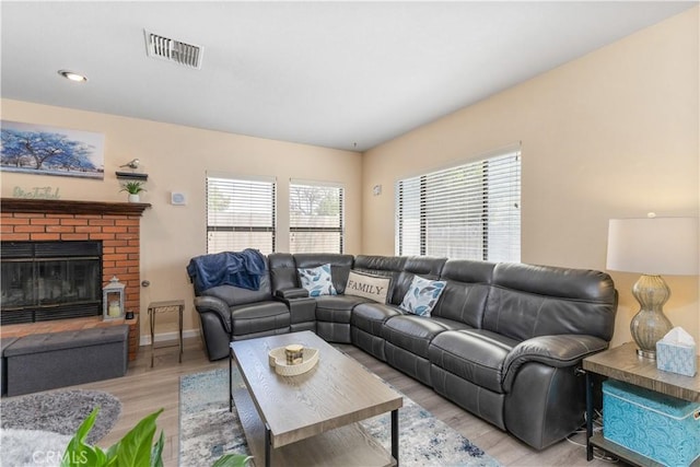 9375 Musselman Dr Unit A, Atascadero, CA 93422 - living area with light wood-type flooring, visible vents, and a fireplace