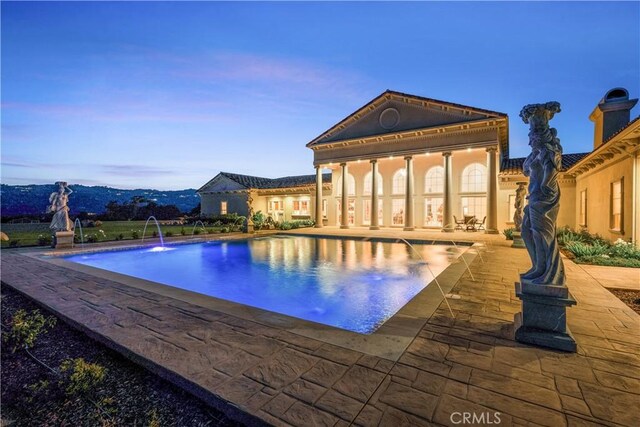 pool with a patio