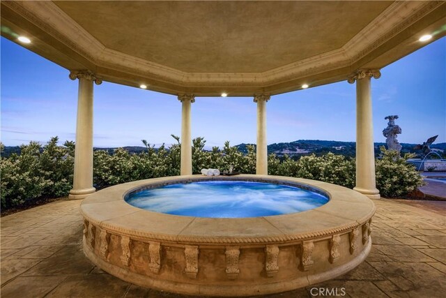 view of pool with an in ground hot tub