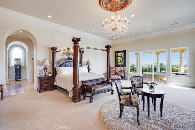 bedroom with ornamental molding, light carpet, recessed lighting, arched walkways, and a notable chandelier