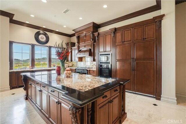 kitchen featuring crown molding, stainless steel appliances, visible vents, and tasteful backsplash