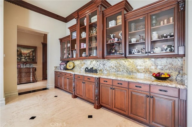 bar featuring baseboards, ornamental molding, and decorative backsplash