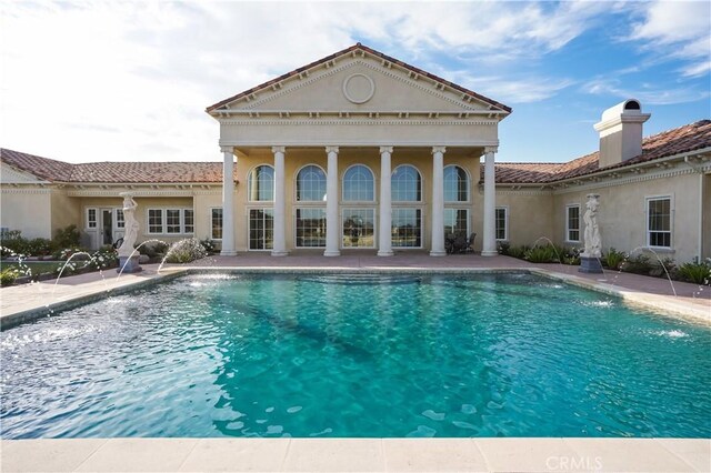 outdoor pool featuring a patio area