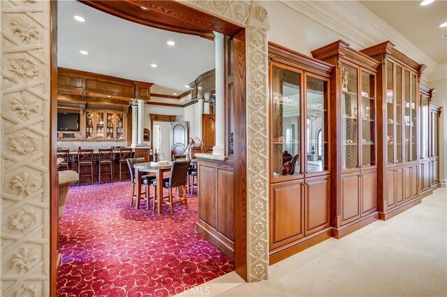 interior space featuring recessed lighting, ornamental molding, and carpet