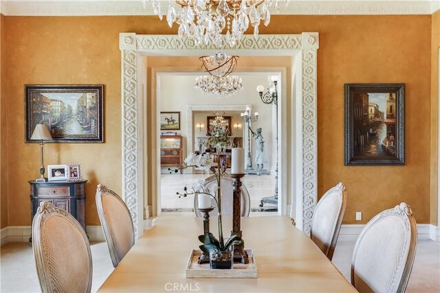 dining area featuring a notable chandelier