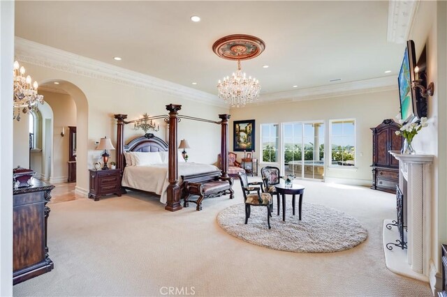 carpeted bedroom with recessed lighting, arched walkways, a chandelier, and ornamental molding