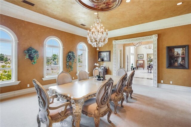 dining area with an inviting chandelier, light carpet, and visible vents