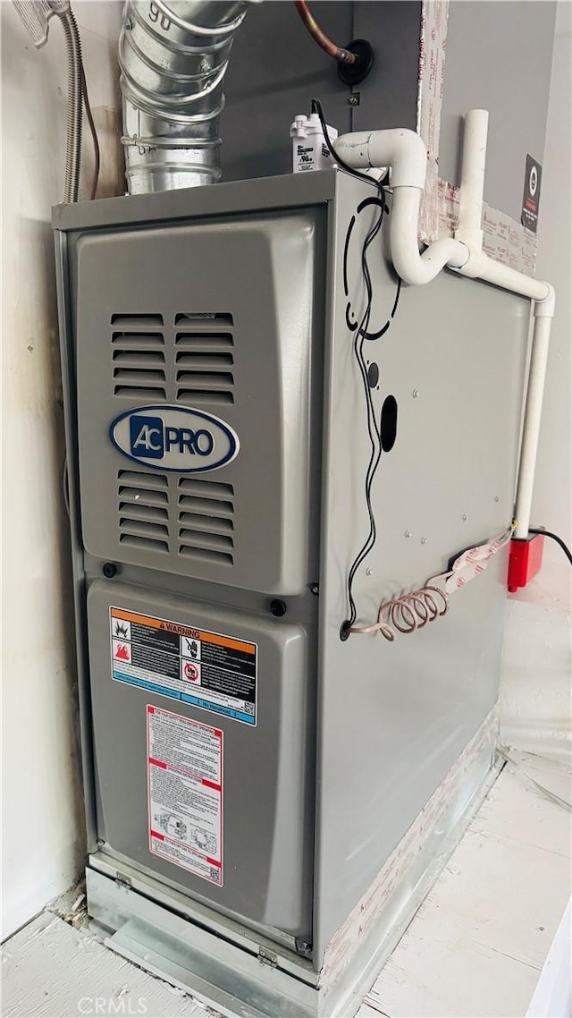 utility room with heating unit