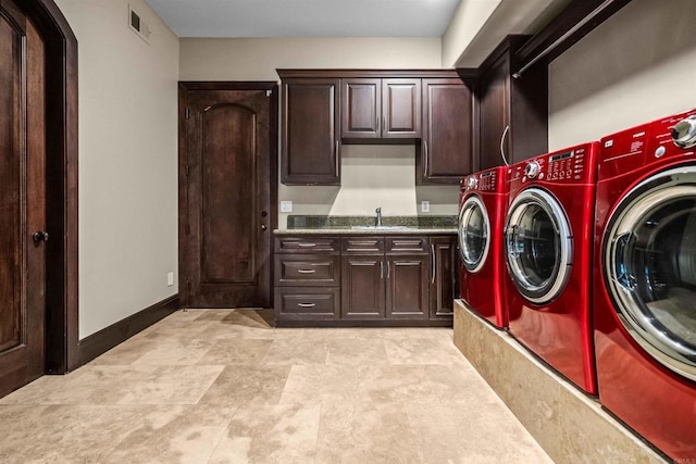 2890 Gate Fifteen Pl, Chula Vista, CA 91914 - clothes washing area with washing machine and dryer and cabinet space