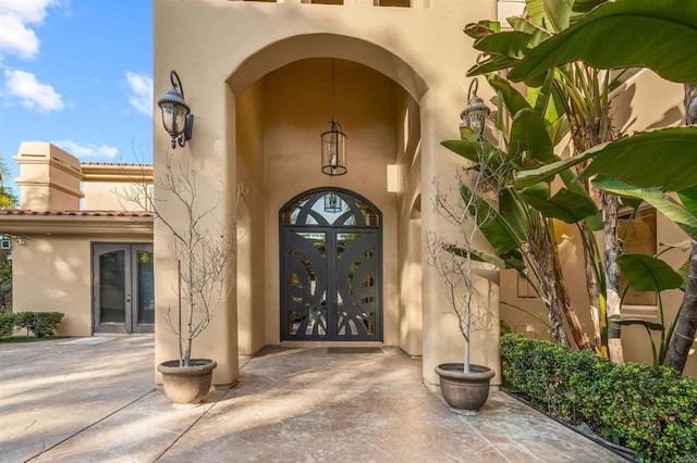 2890 Gate Fifteen Pl, Chula Vista, CA 91914 - view of exterior entry with french doors and stucco siding