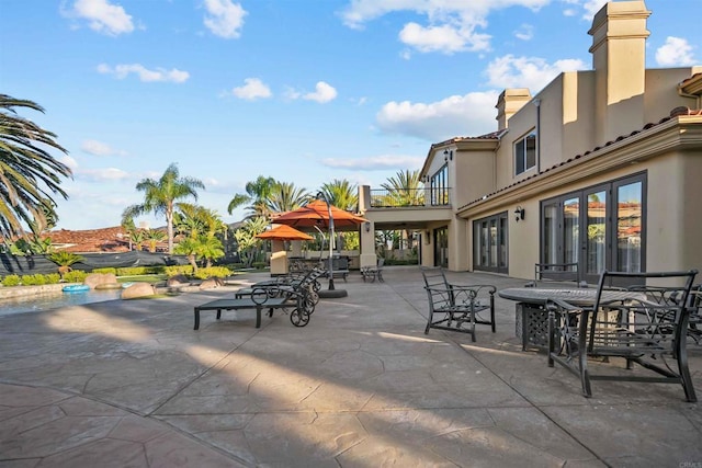 2890 Gate Fifteen Pl, Chula Vista, CA 91914 - view of patio / terrace featuring outdoor dining area, a balcony, and french doors