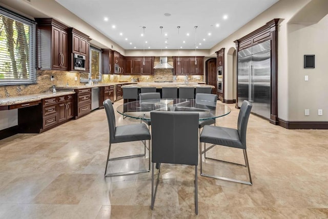 2890 Gate Fifteen Pl, Chula Vista, CA 91914 - dining room featuring arched walkways and baseboards